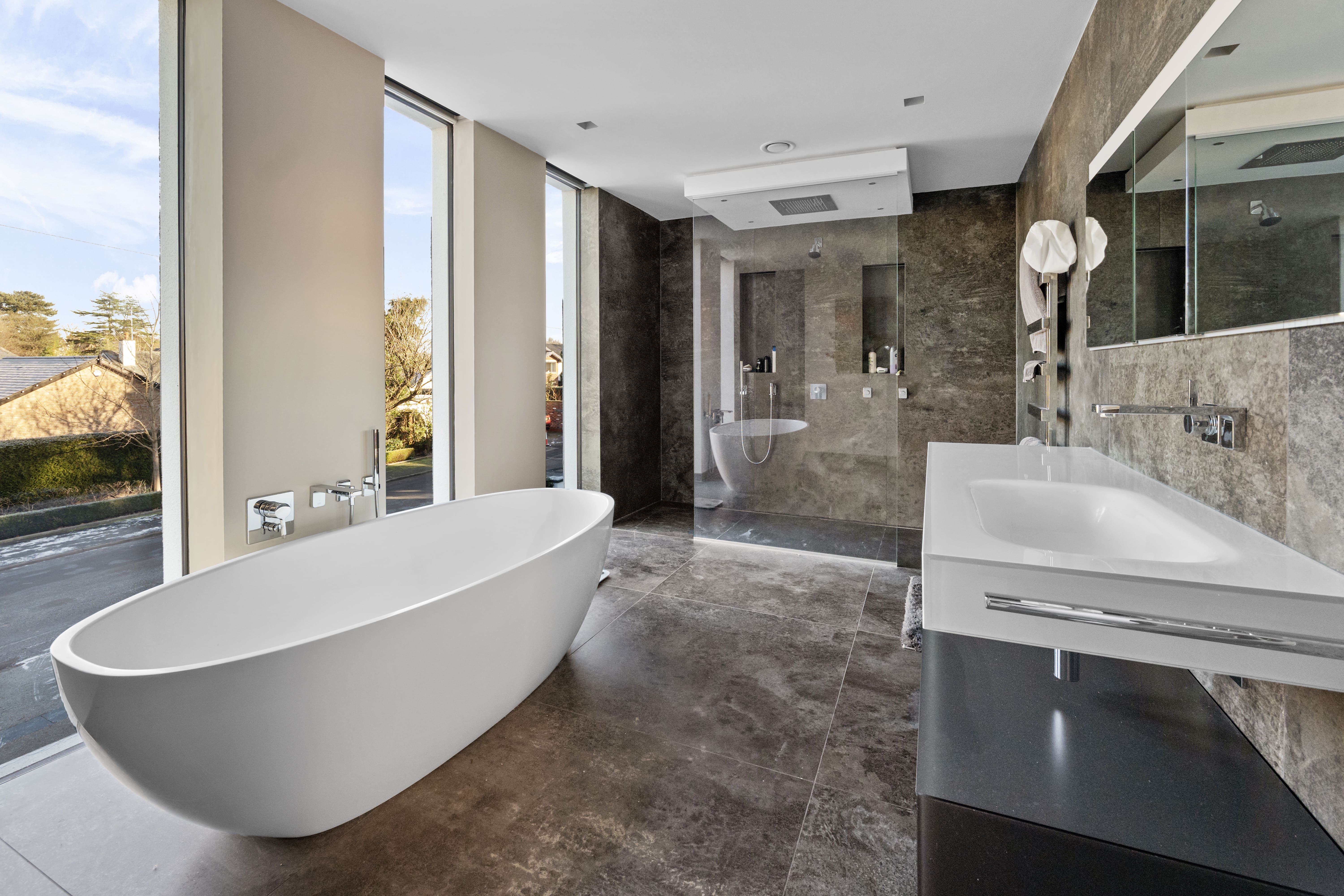 Principal bathroom with freestanding bath and walk-in stone shower